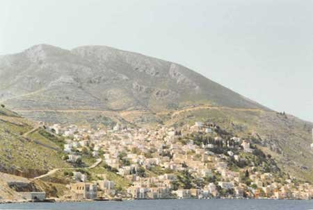 villages on hillside greek island of simi