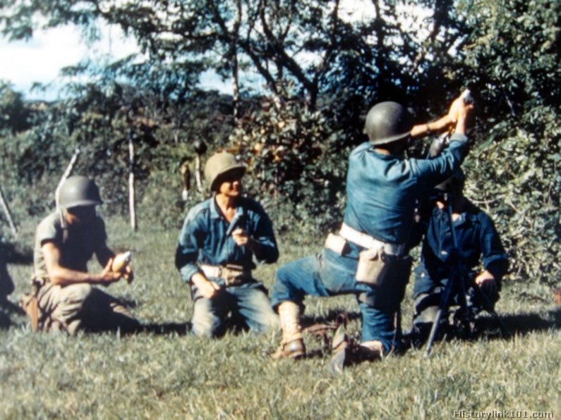 Royalty Free Pictures of 158th Infantry firing 81mm mortar.
